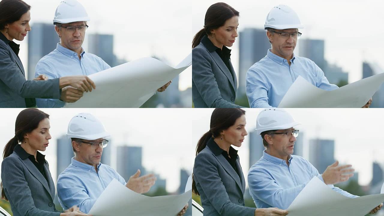 总工程师向商业女性投资者展示项目草案。在摩天大楼的背景城市。