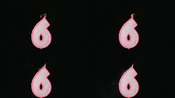 六个生日蜡烛在黑色背景上闪烁并熄灭