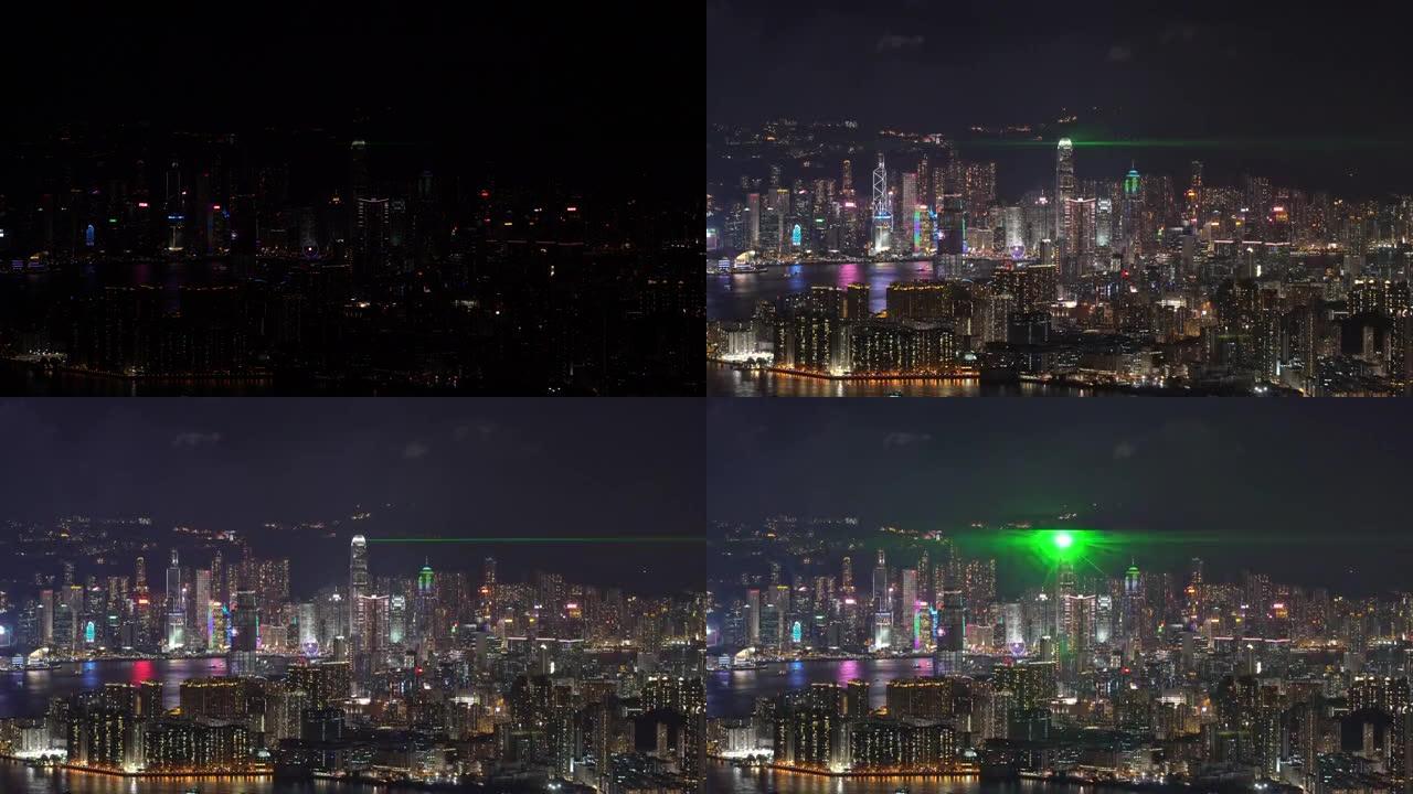 维多利亚港夜间香港城市景观河景的4k剪辑片段，展示了香港灯光交响乐，展示了现代建筑和交通概念