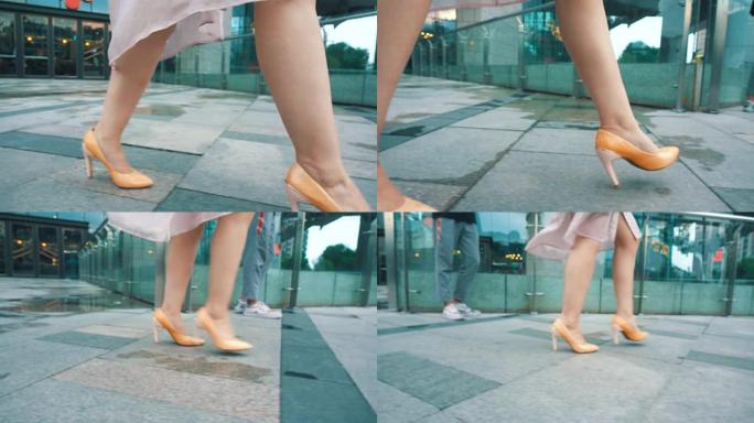 穿着高跟鞋走路的女人的腿