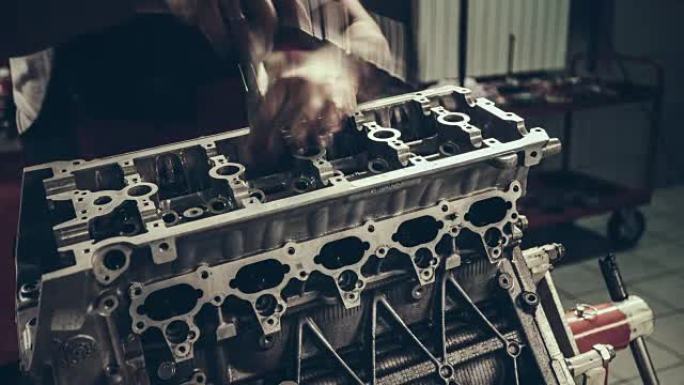 Professional mechanic repairing V10 engine in auto