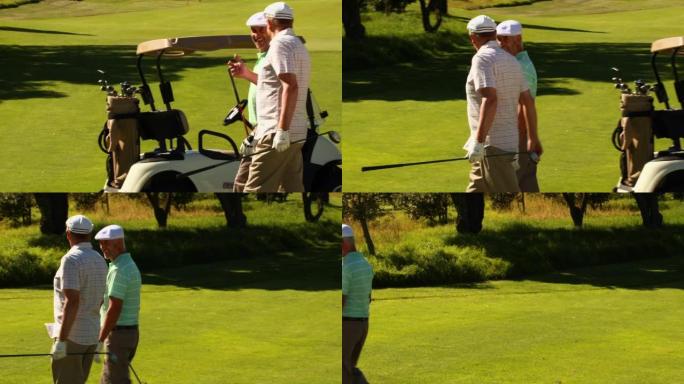 两个男性朋友在高尔夫球场聊天和散步