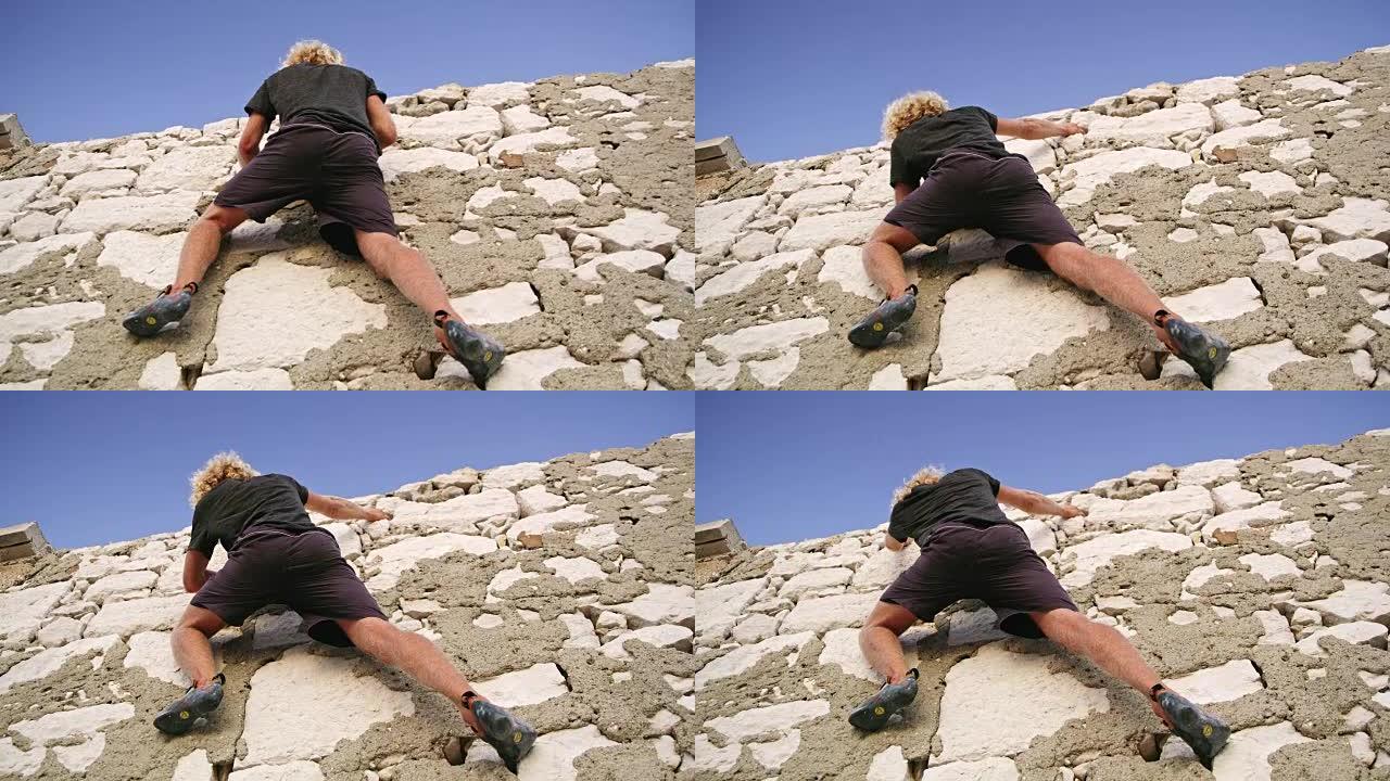 男子攀岩，缩放岩石面，实时