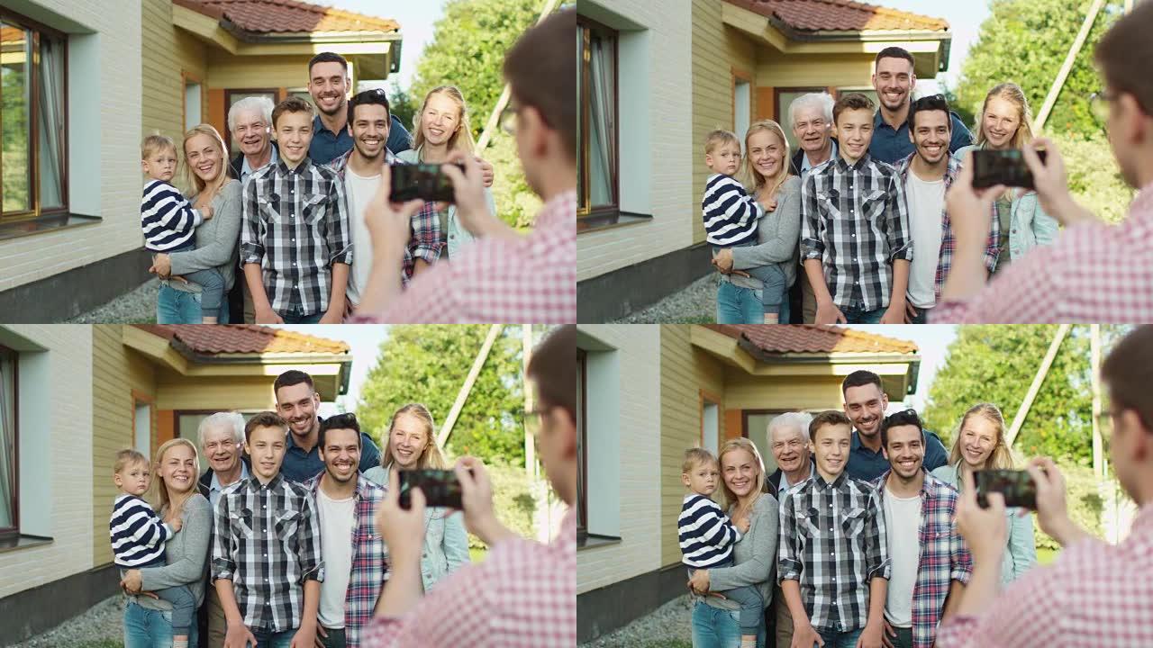 男人在给他的大家庭拍户外照片。