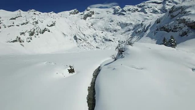 Aerial view of snow covered mountain range with be