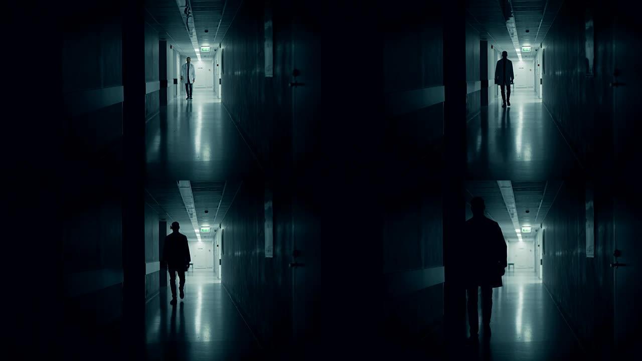医生走进医院走廊的黑暗部分。