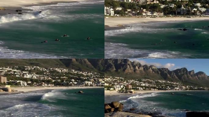 缩小南非冲浪者和营地湾海滩