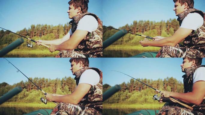 年轻人坐在森林湖的船上，扔了一根棍子。有吸引力的雄性用旋转卷轴钓竿抓鱼