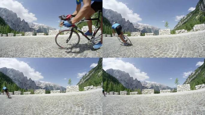 慢动作: 无法识别的职业自行车手加速驶过令人叹为观止的绿色山脉