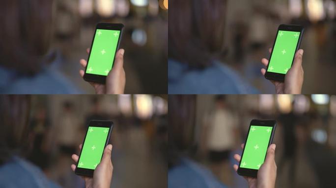 观看带有绿色屏幕的智能手机