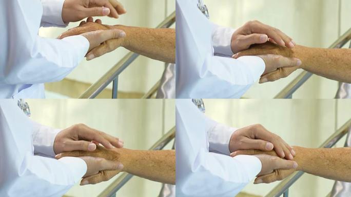 医生通过触摸手来安慰病人