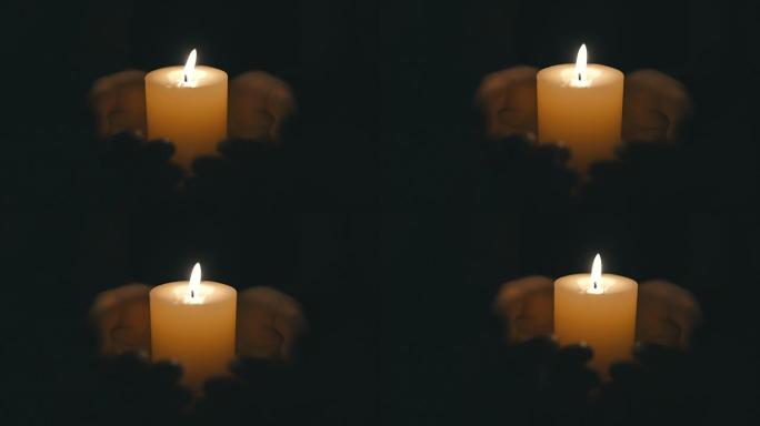 手握着燃烧的蜡烛手捧蜡烛特写视频素材