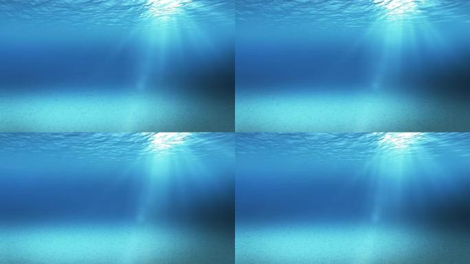 从水下 (4k，无缝循环) 看到的蓝色柔和的波浪，慢动作环绕着海洋表面的阳光透过非常适合背景