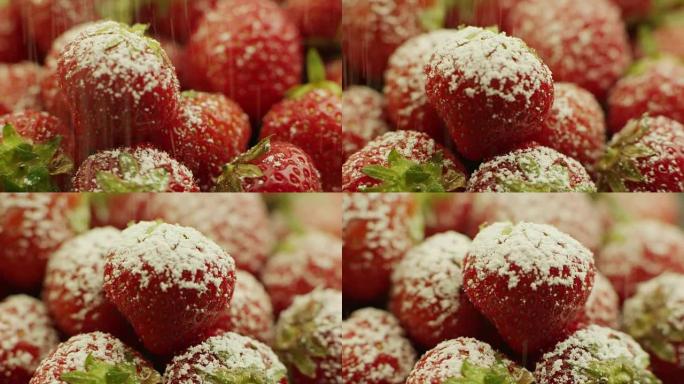 在草莓上撒上糖粉