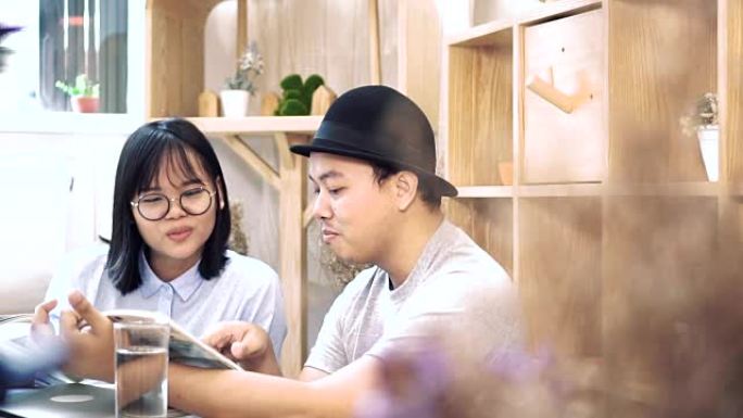 慢动作FHD剪辑亚洲情侣休闲套装阅读与探讨现代合作空间中的商务工作、情侣与生活理念