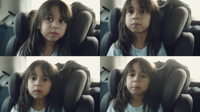 儿童汽车座椅上的漂亮女孩
