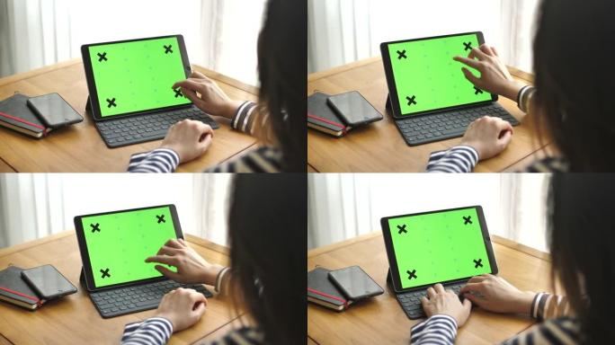 在家里使用绿色屏幕的数字平板电脑，水平