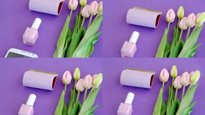 紫色背景4k上的鲜花，钱包，指甲油和手机