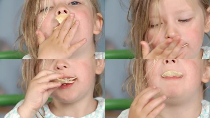 女孩吃一包薯片的特写