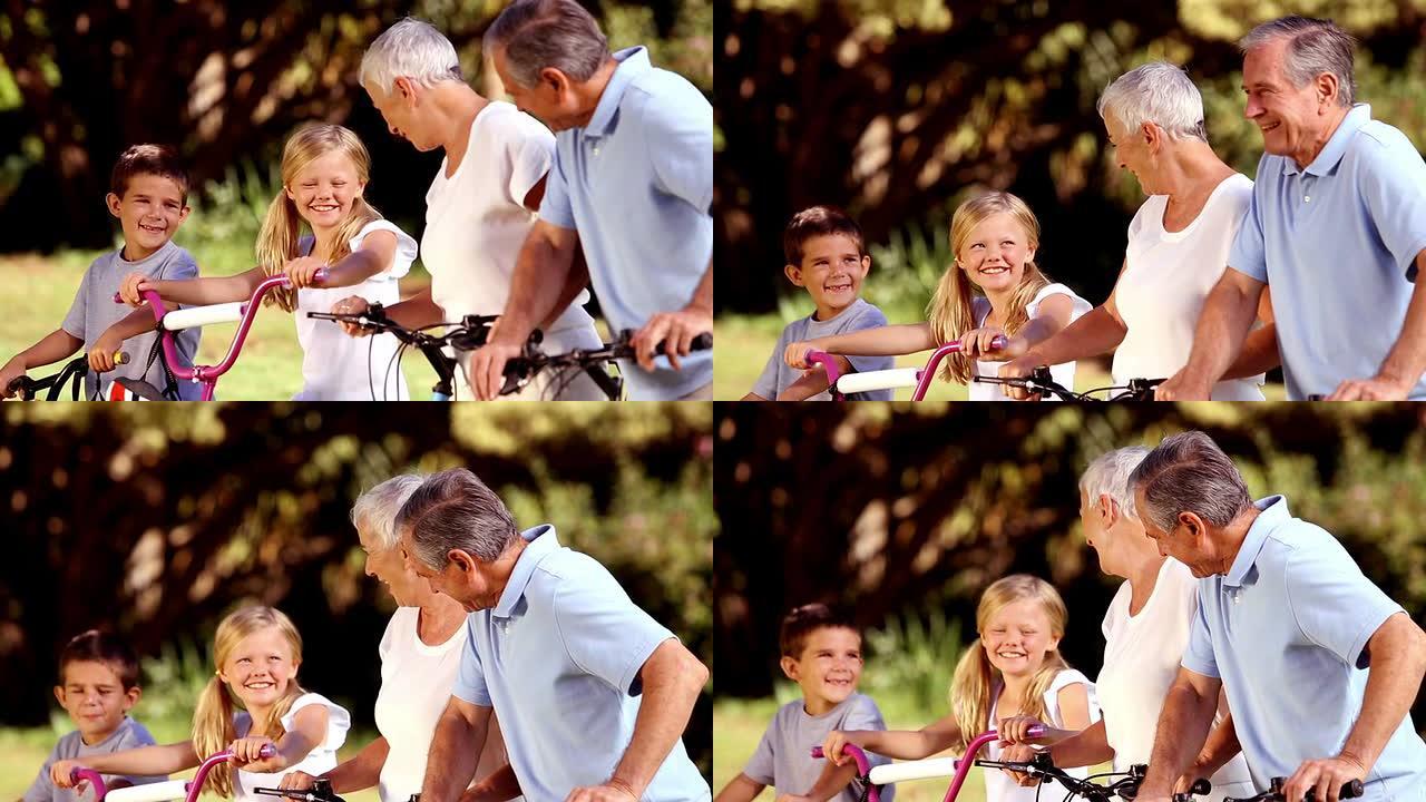 骑自行车的祖父母和孙子