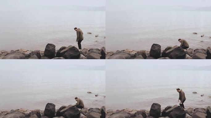 加利利海边缘的高加索人。金纳雷特提比略湖畔的大石头。以色列。宗教朝圣者。4K