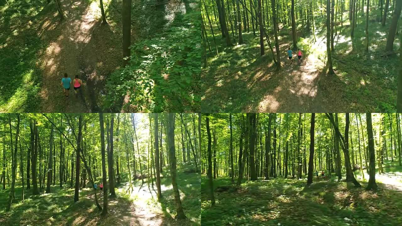 空中男人和女人在森林中奔跑