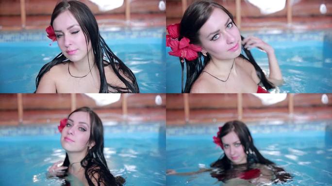 性感的年轻女子在游泳池里调情放松