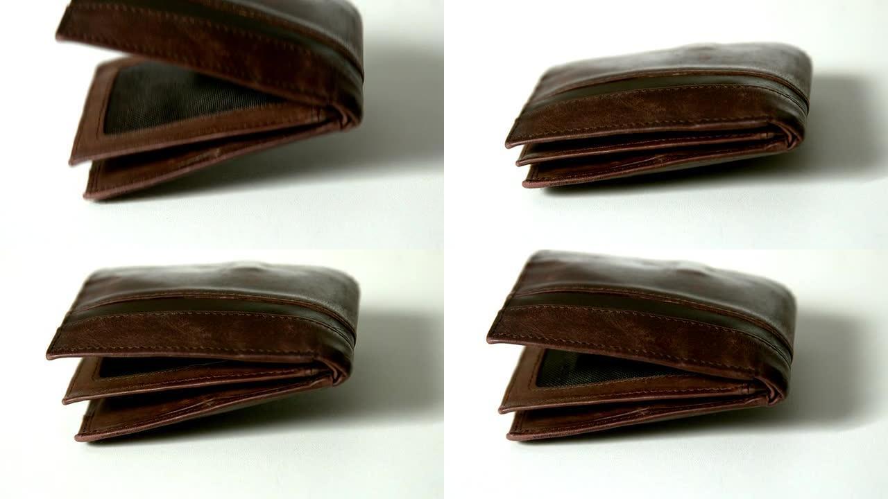 棕色皮革钱包落在白色表面上