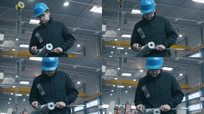 工厂工人正在使用测量工具对金属细节进行质量控制。