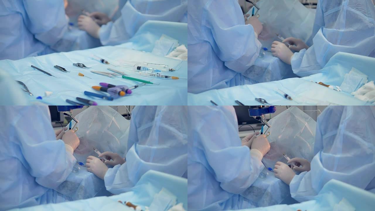 在显微镜下眼科手术期间，患者附近的设备和工具婴儿床。