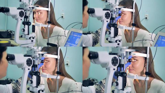 一名女性患者用裂隙灯接受眼睛健康测试。4K。