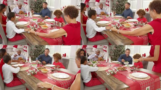 家人在R3D上拍摄圣诞大餐前说恩典