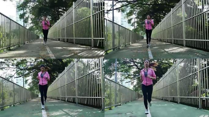 年轻的亚洲女人早上在人行道上跑步。具有复制空间的健康意识概念。健身运动人群与健康生活理念。