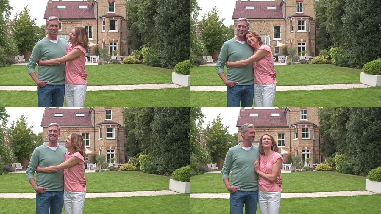 成年夫妇在新后院房子的实时视频。