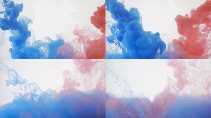 明亮多彩的背景。蓝色和红色液体墨水颜色在水中混合