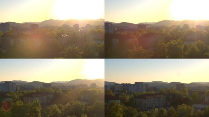 空中: 在金色的夏日日落时，在公寓大楼社区房屋周围飞行