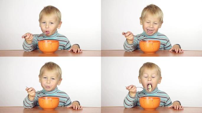 小男孩用叉子吃饭