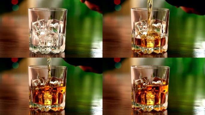 将苏格兰威士忌倒入加冰的玻璃杯中