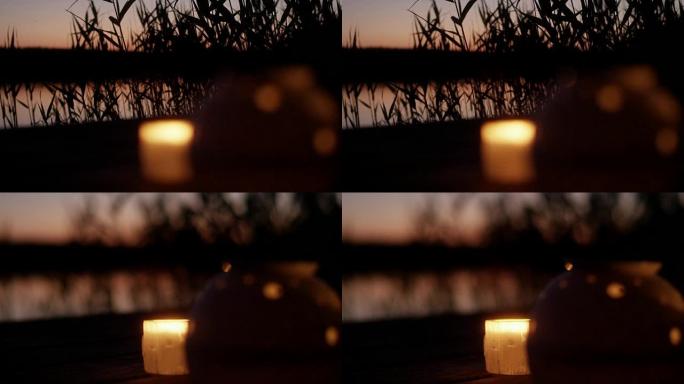 日落时的湖码头。浪漫的蜡烛和灯笼