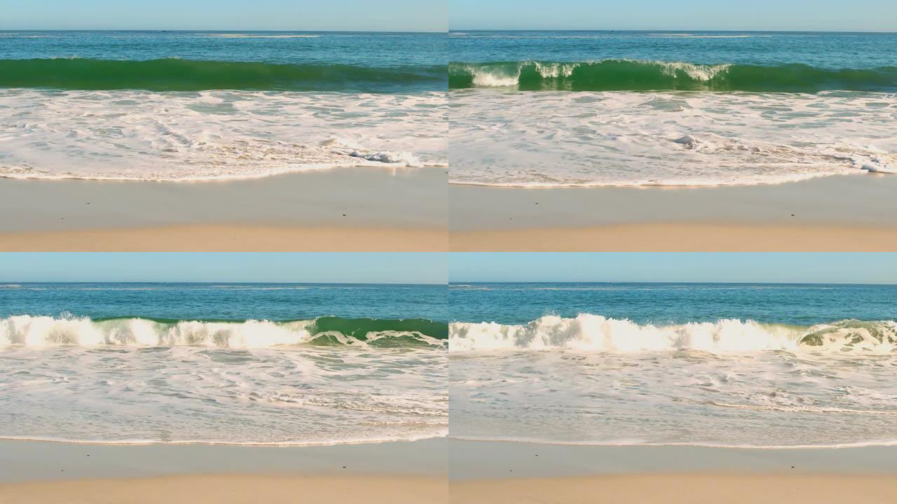 海浪压在沙滩上