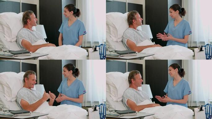 卧床的男性患者在医院病房与医生交谈