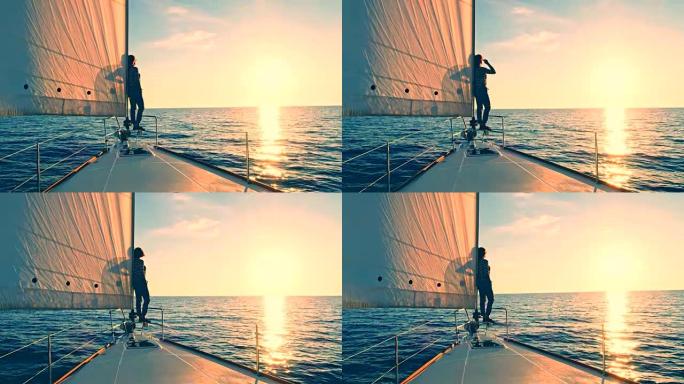 WS女人从帆船的船头享受日落