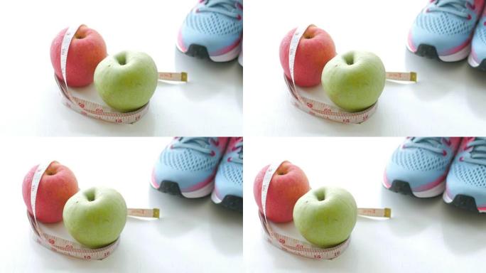 健康生活方式水果和苹果与运动设备的健康概念