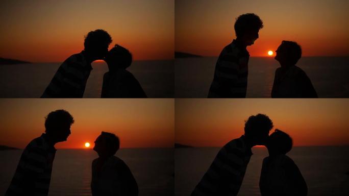 浪漫的高级情侣在日落时接吻