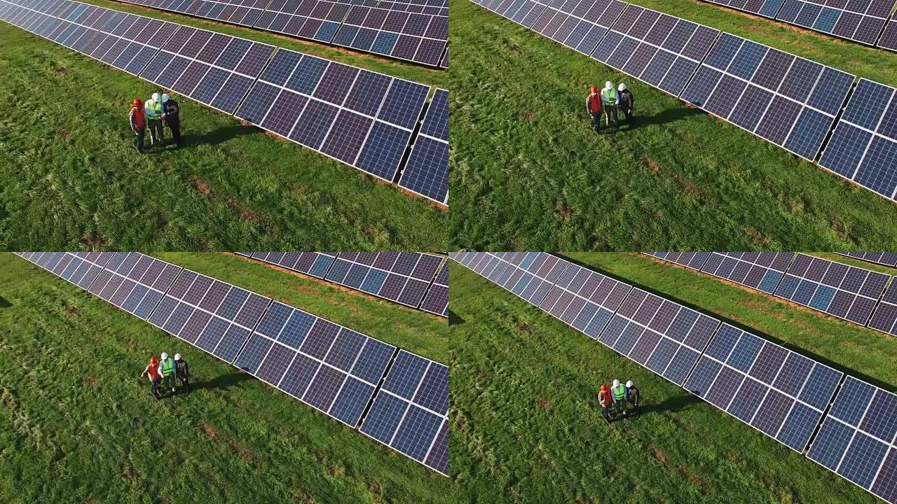 太阳能农场的三名技术人员