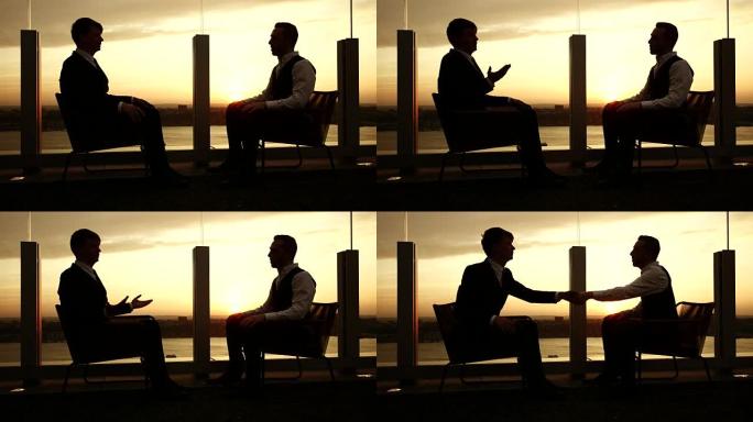 两个白人同事分析他们的业务数据。图表，图形和图表象征着增长。