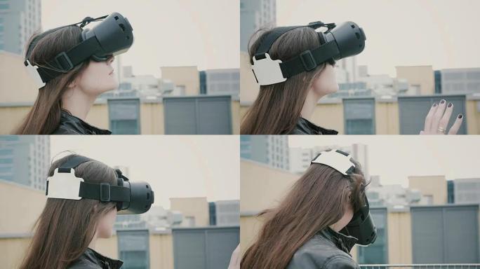 挥舞着头发的黑发女女孩在屋顶上使用虚拟现实眼镜。全高清