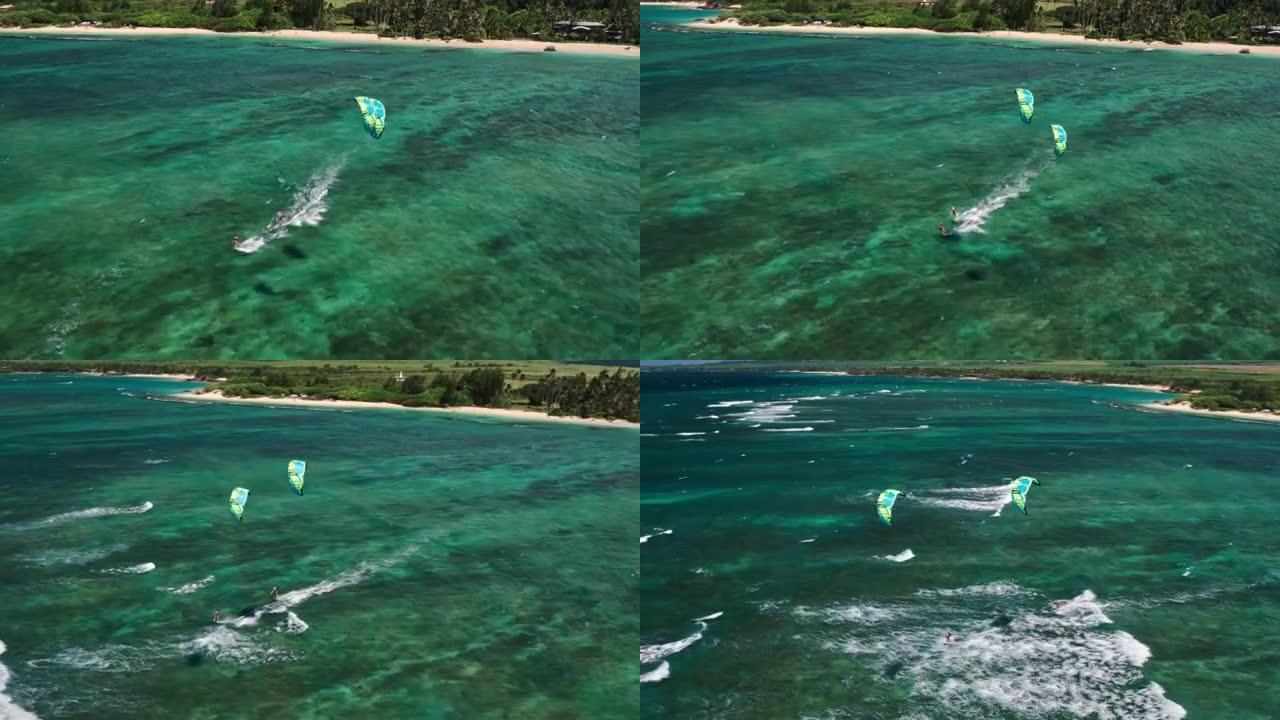 滑过蓝色海洋的风筝冲浪者的鸟瞰图