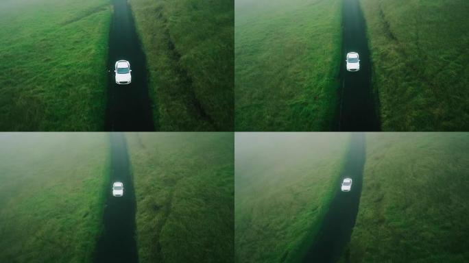 在乡村道路上行驶的鸟瞰图电动汽车