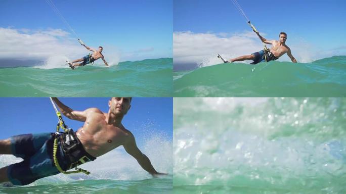 男子风筝在夏日在海洋中冲浪，极限运动